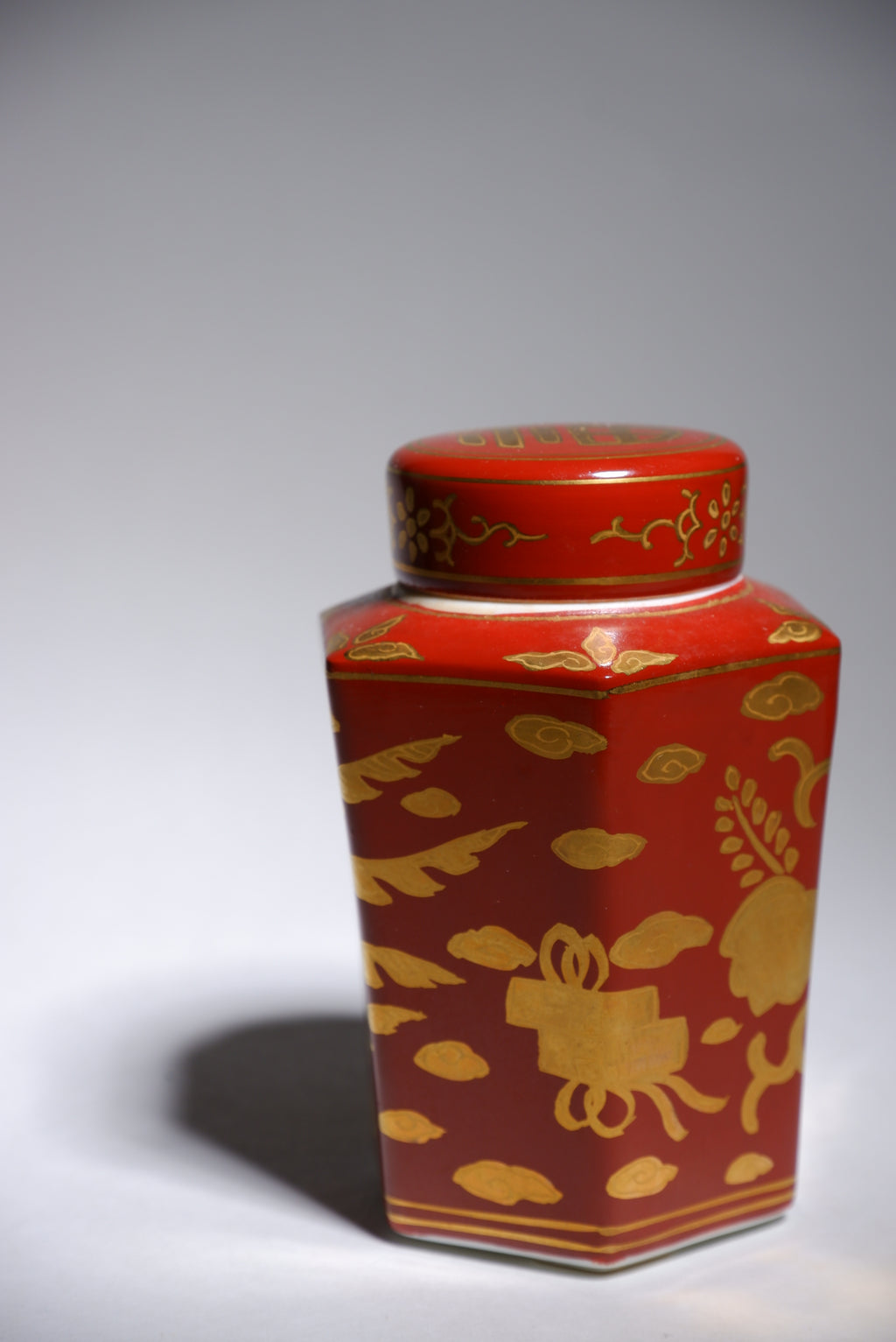 Harumine  Tea Caddy with Phoenix Design on Red Ground and Kinrande Decoration